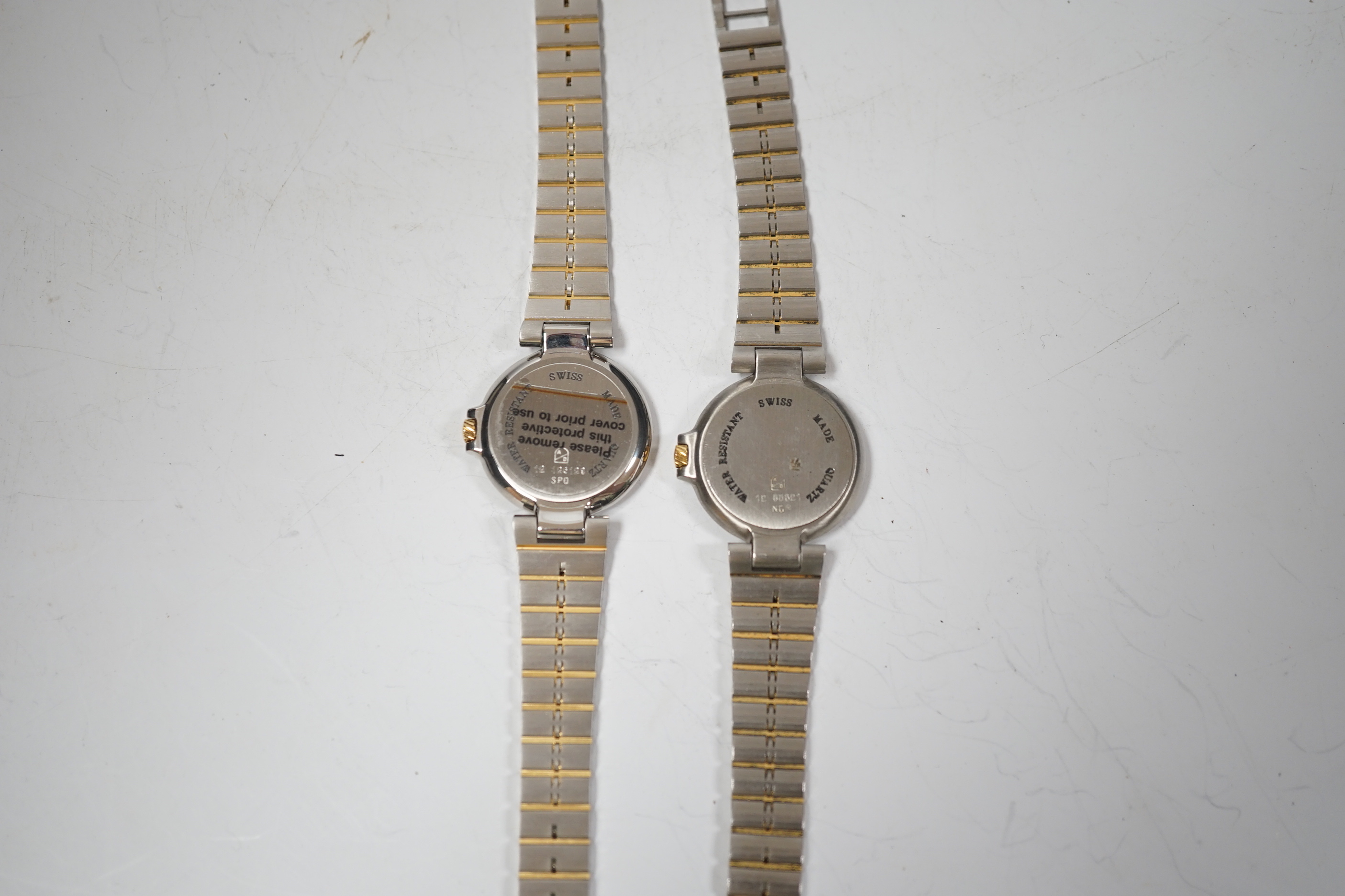 Two lady's steel and gold plated Dunhill quartz wrist watches, one with Dunhill box.